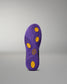 Purple shoe sole with yellow dots on a gray background