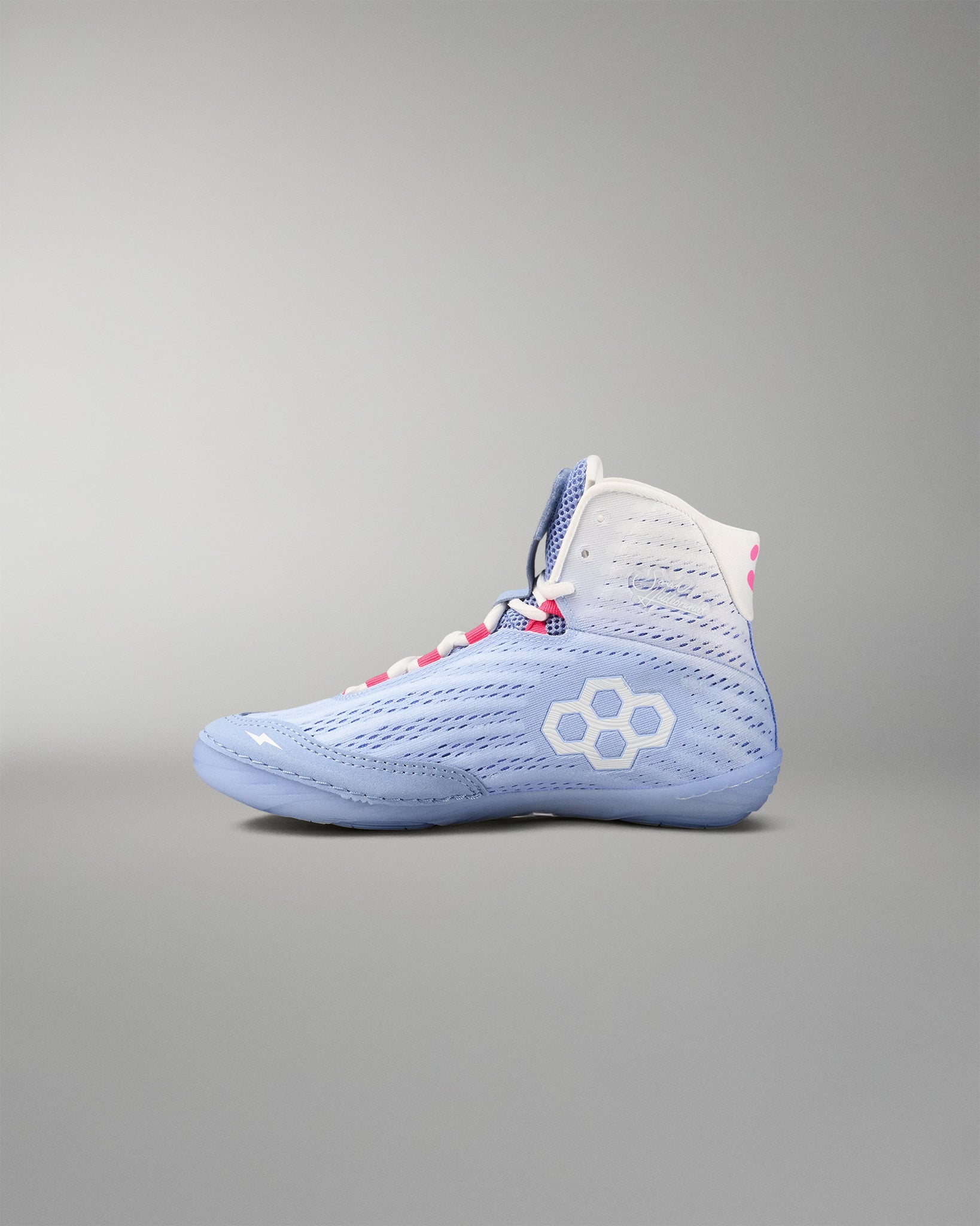 Blue wrestling shoe with a white logo on a gray background