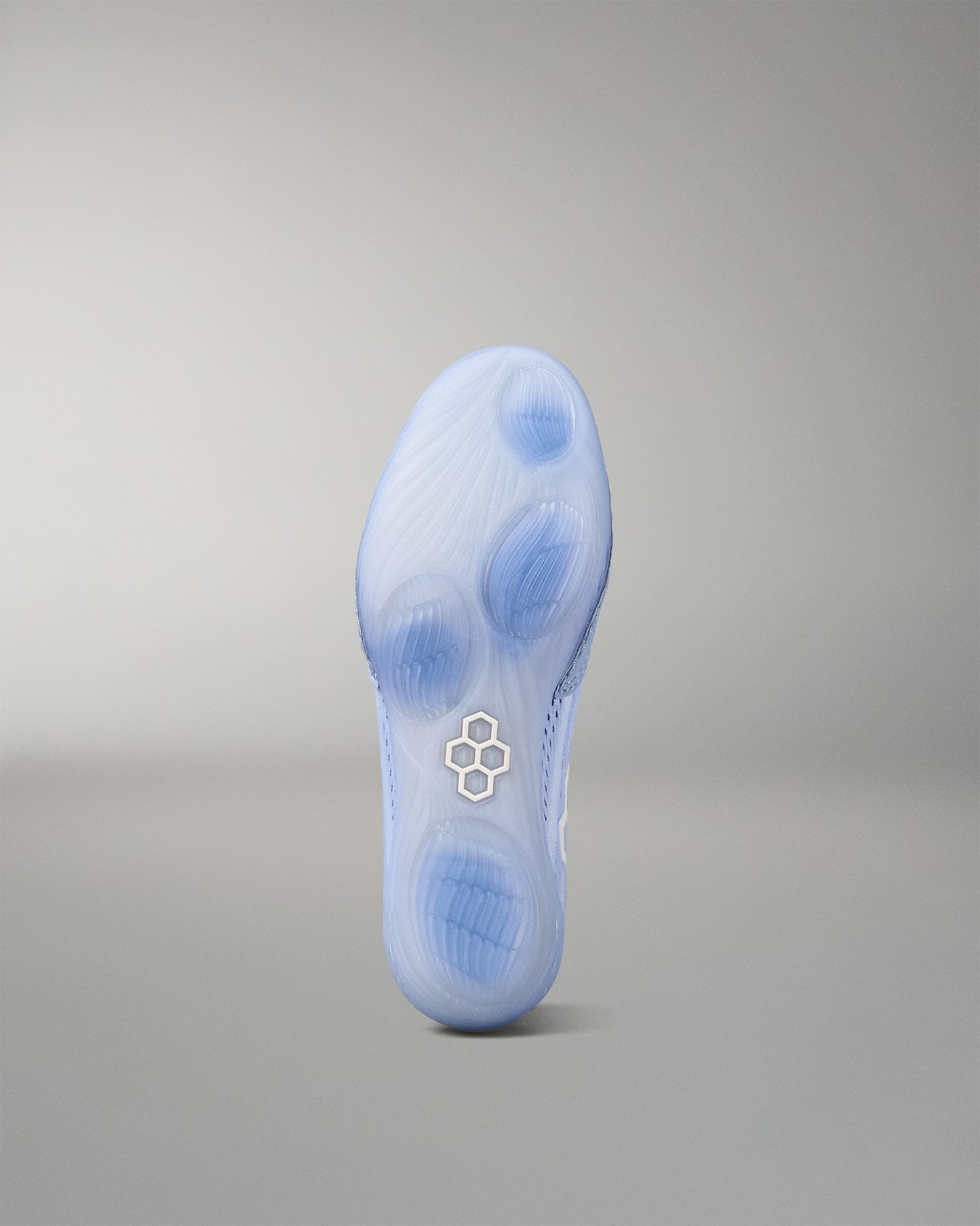 Blue wrestling shoe sole with a RUDIS brand logo on a gray background