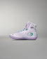 White high-top sneaker with green accents on a gray background