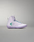 White high-top sneaker with a green logo on a gray background