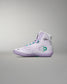 White high-top sneaker with green accents on a gray background