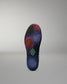 Cushioned shoe sole with a brand logo on a gray background