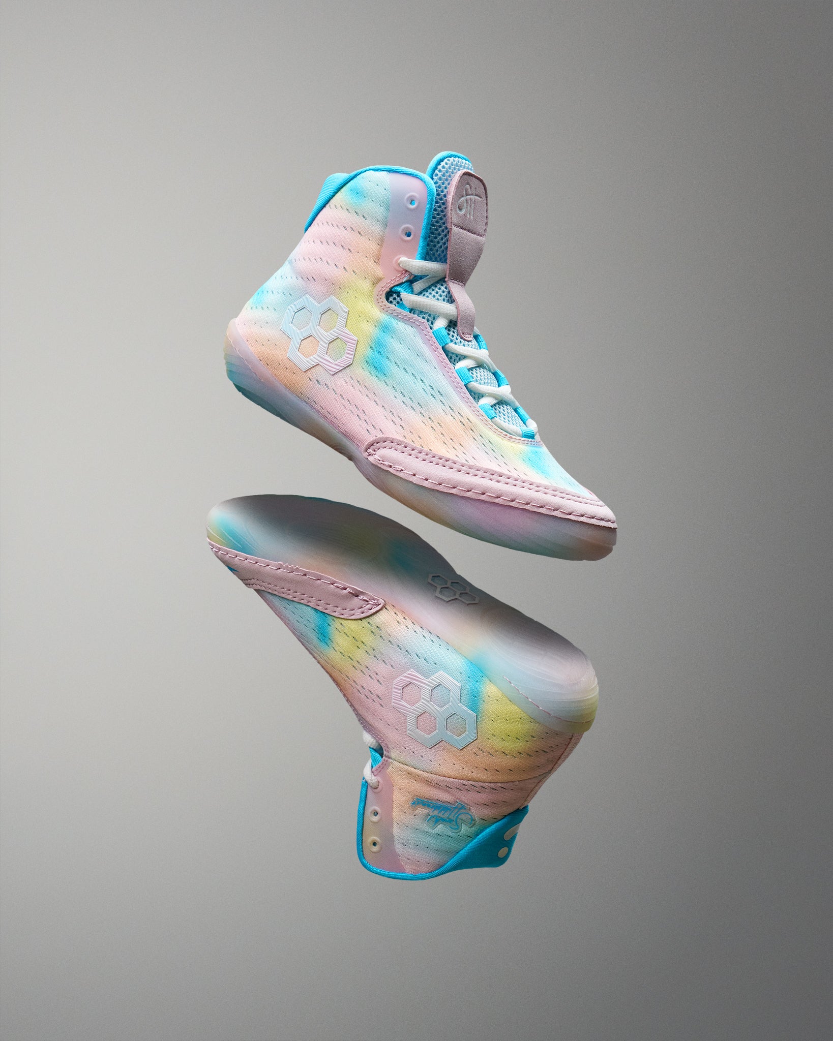 Colorful Wrestling shoes with a gradient design on a gray background