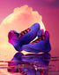 Blue and purple wrestling shoe with a reflective surface and colorful background