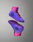 Purple and pink wrestling shoes with a geometric design on a gray background