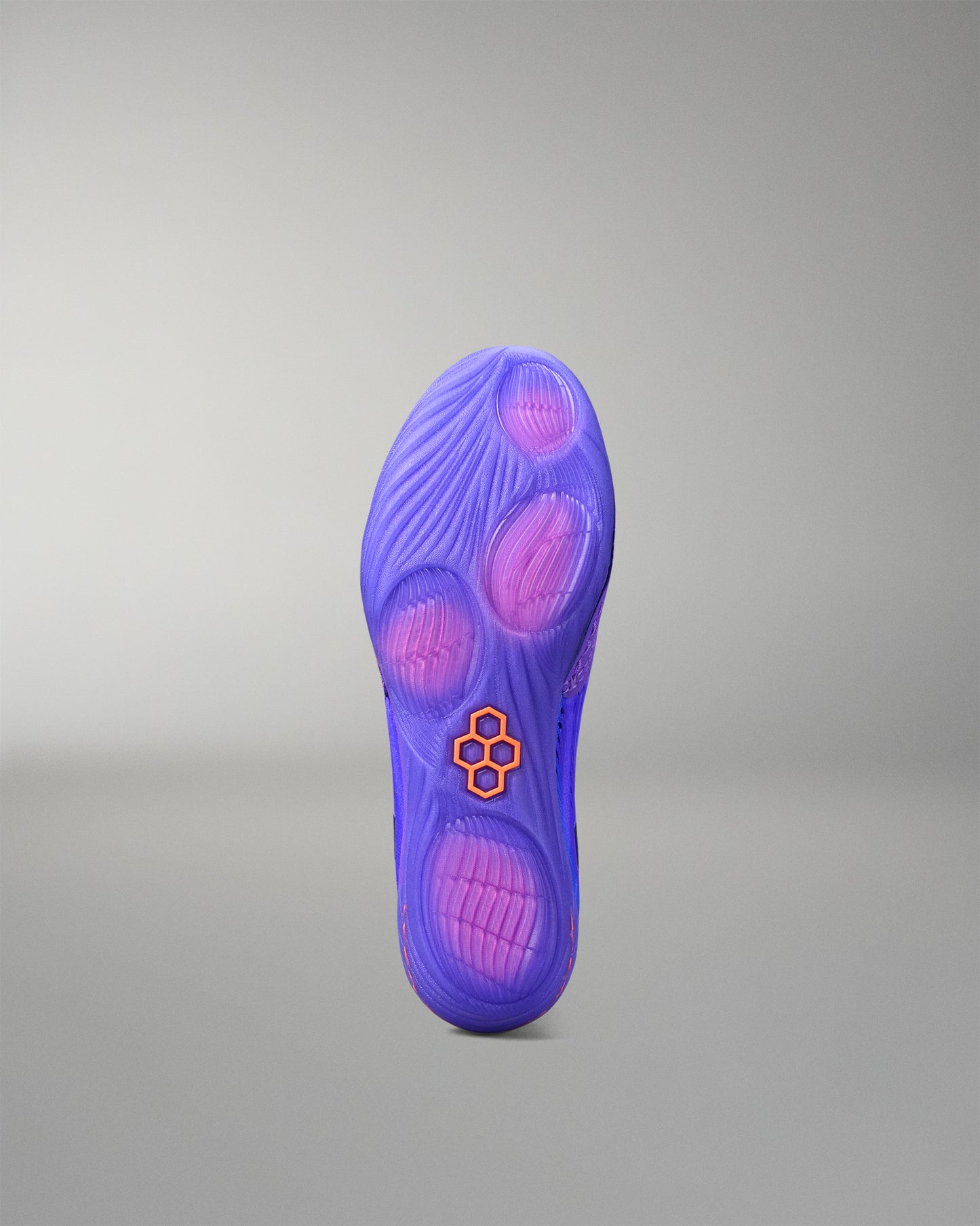 Purple wrestling shoe sole with a brand logo on a gray background
