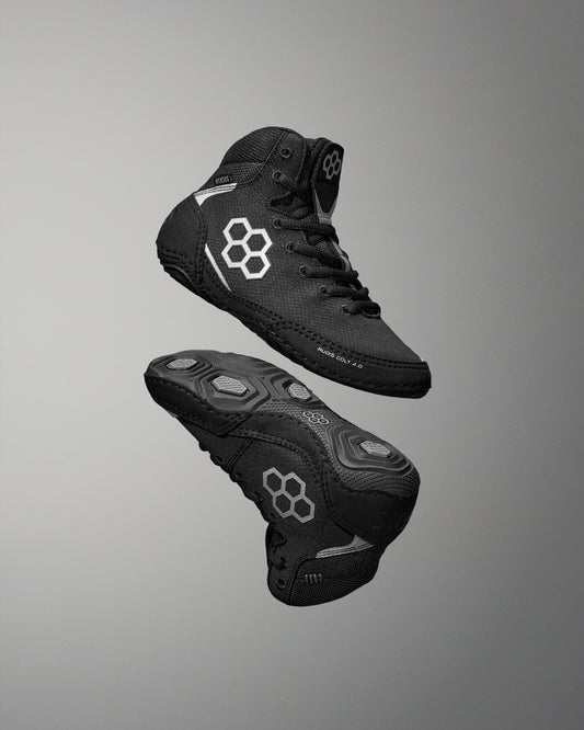 Black Wrestling Shoes with brand logo on a gray background