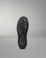 Black Wrestling Shoes sole with textured pattern on a gray background