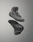 Gray wrestling shoes with black soles on a gray background