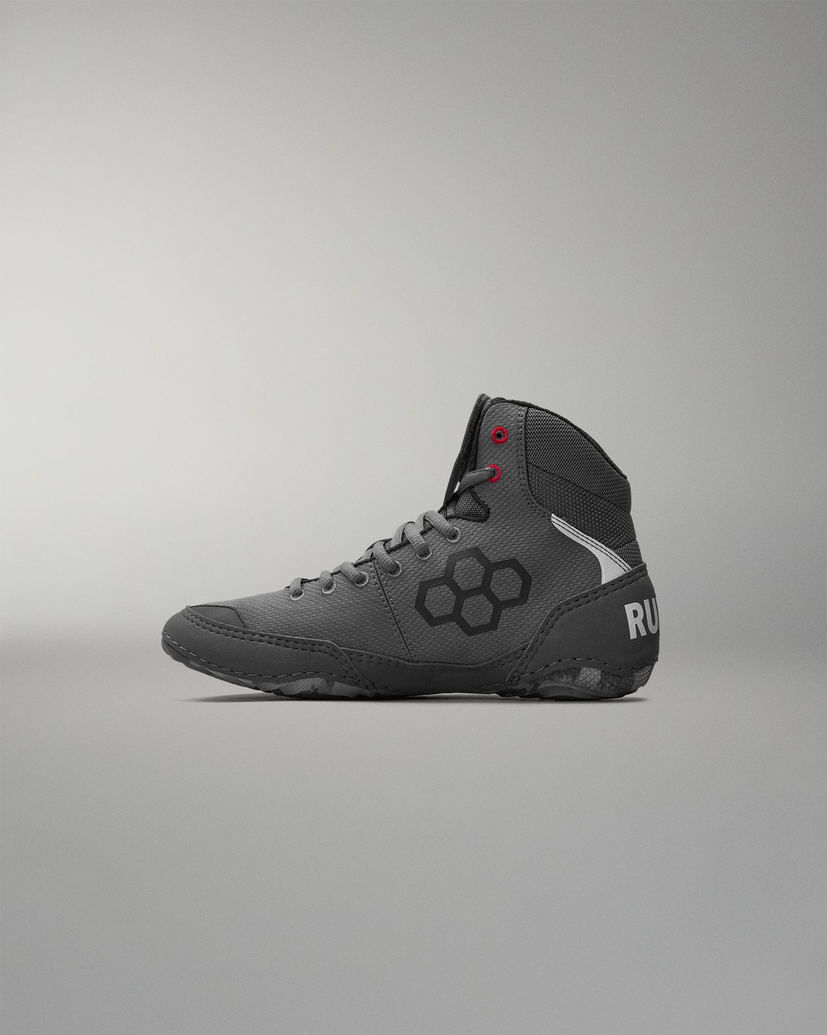 Gray wrestling shoe with 'RUDIS' brand logo on a gray background