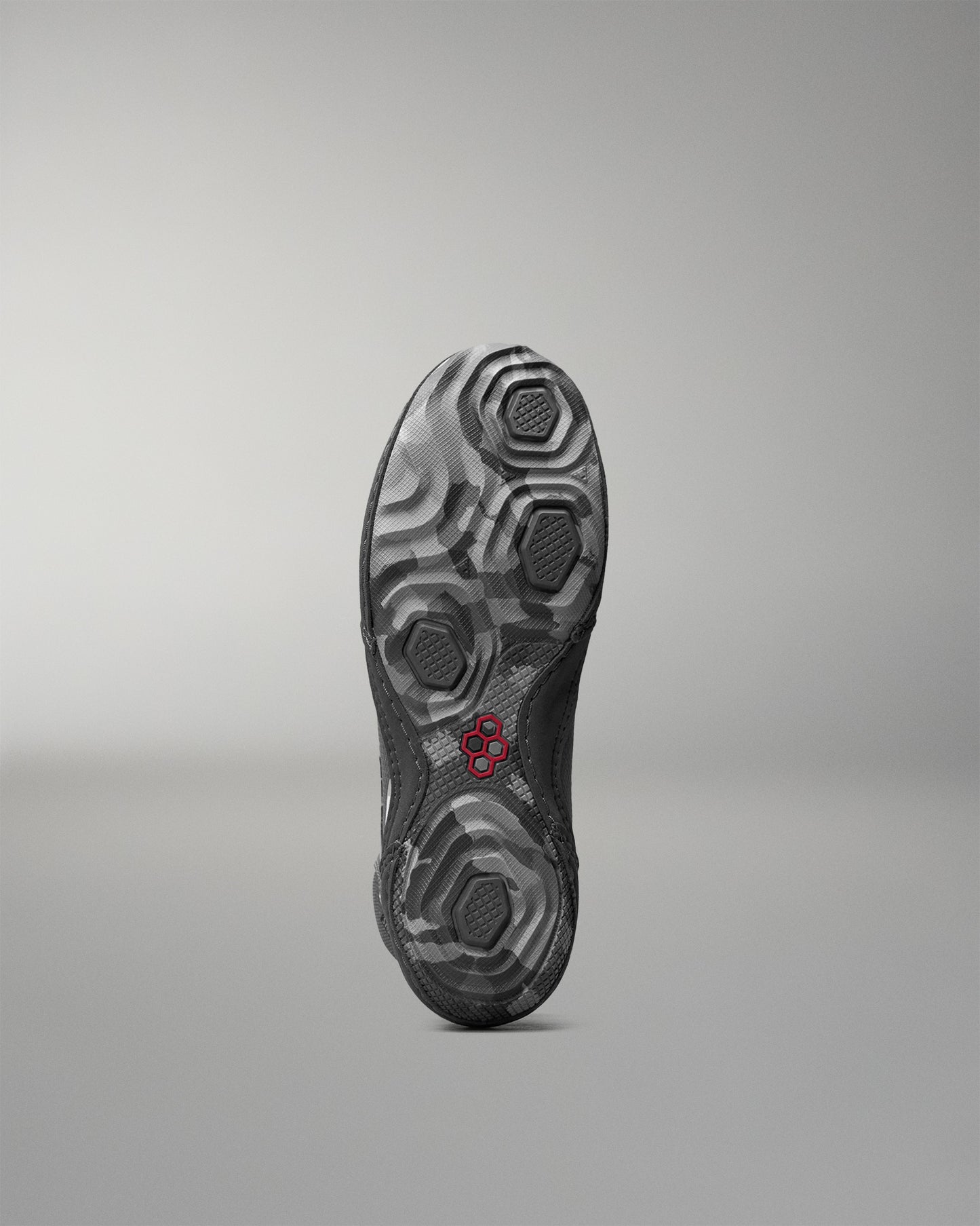 Sole of a wrestling shoe with a 'RUDIS' brand logo on a gray background