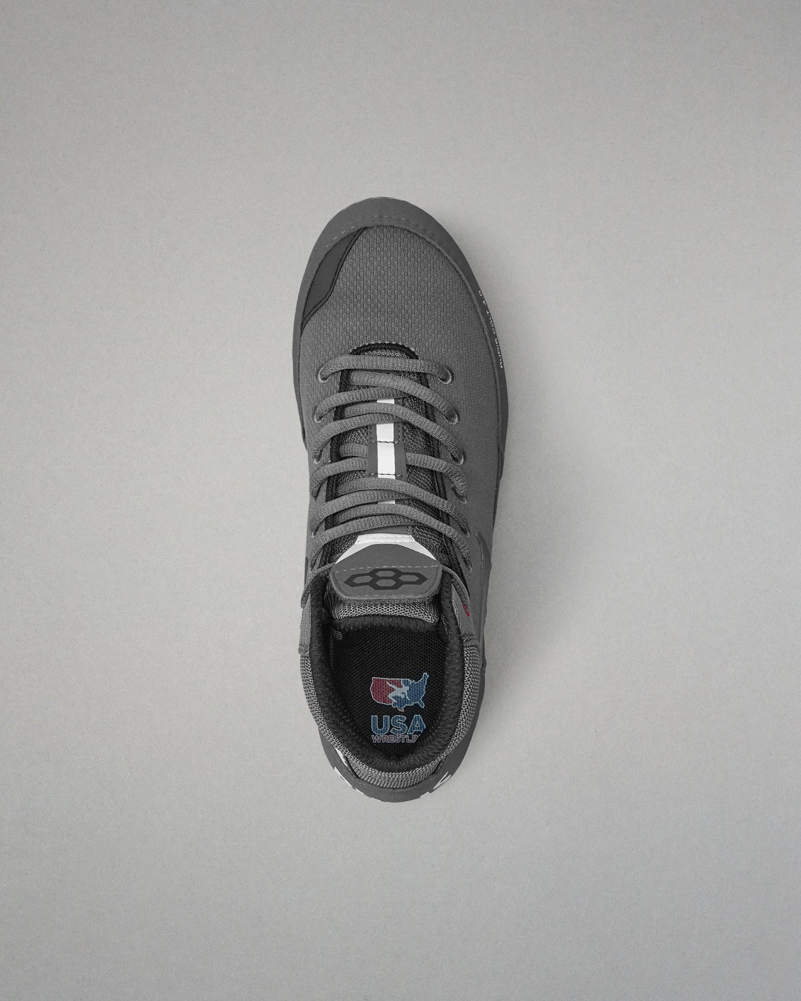 Gray wrestling shoe on a light gray background