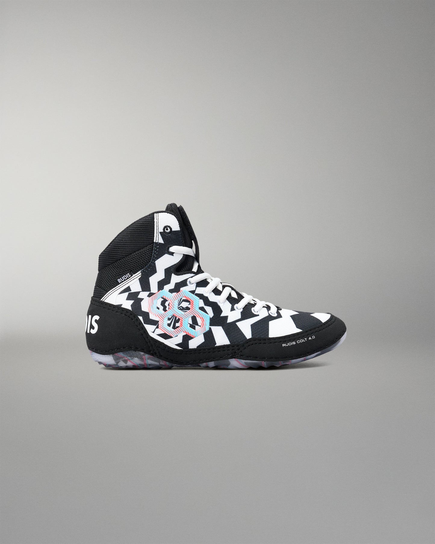 A high-top wrestling shoe in black, white, and gray with a colorful abstract floral pattern on the side, shown from the side against a neutral gray background.
