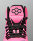 Close-up of the top of a high-top Wrestling shoe in bright pink and black, showing the tongue with a black geometric logo, black laces, and black mesh around the collar on a gray background.