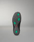 Sole of a wrestling shoe with green hexagonal patterns on a gray background