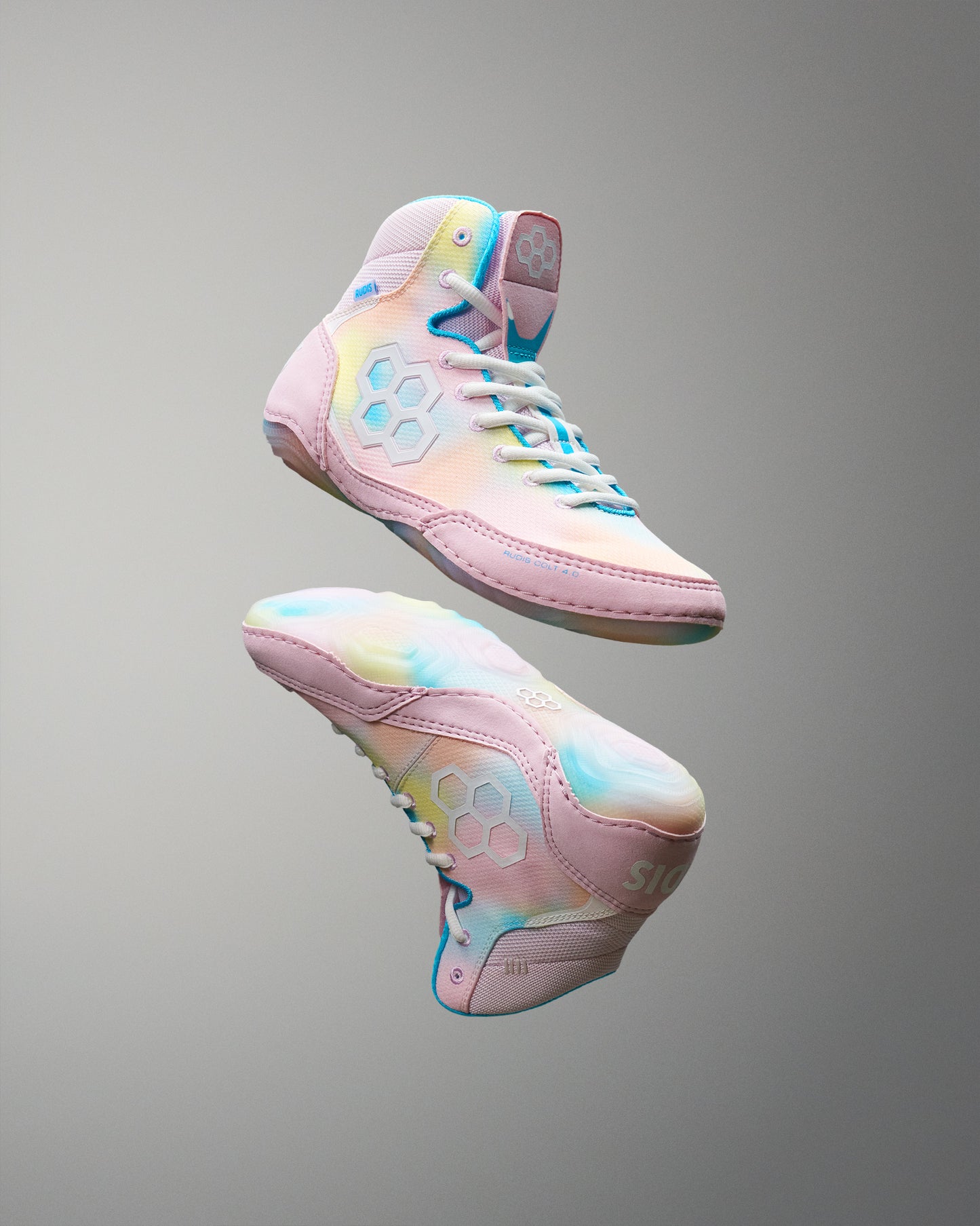 Pastel-colored Wrestling shoes with a gradient design on a gray background