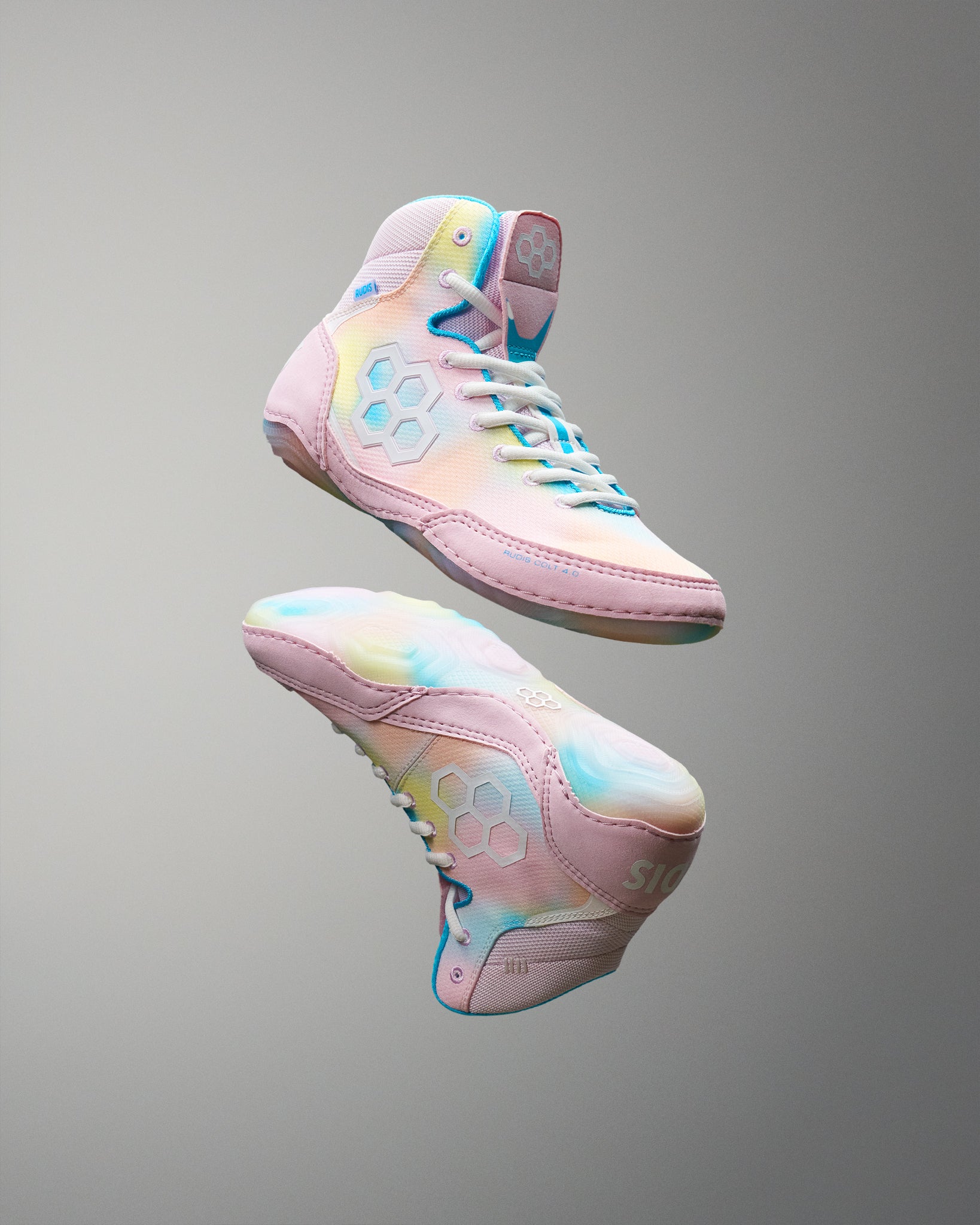Pastel-colored Wrestling shoes with a gradient design on a gray background