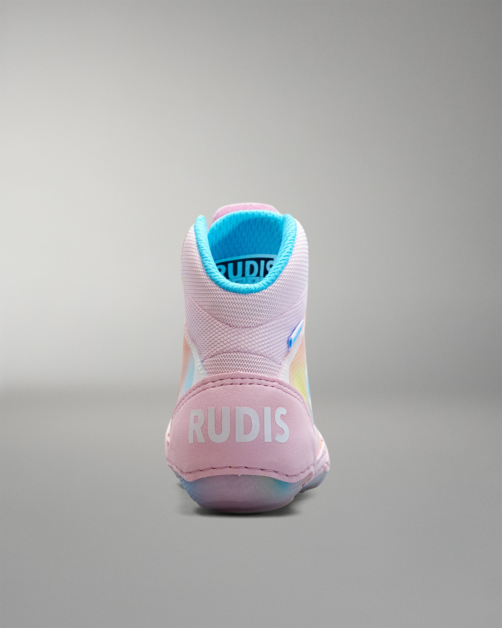Pink Wrestling shoe with blue lining on a gray background