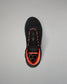 A black Wrestling Shoe with vibrant orange accents, shown from a top-down view on a neutral gray background.