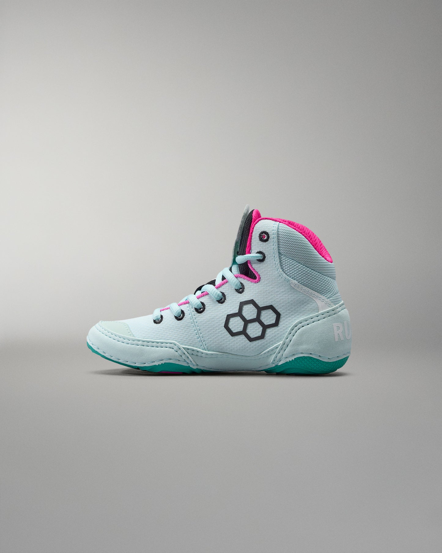Light blue high-top sneaker with pink accents on a gray background