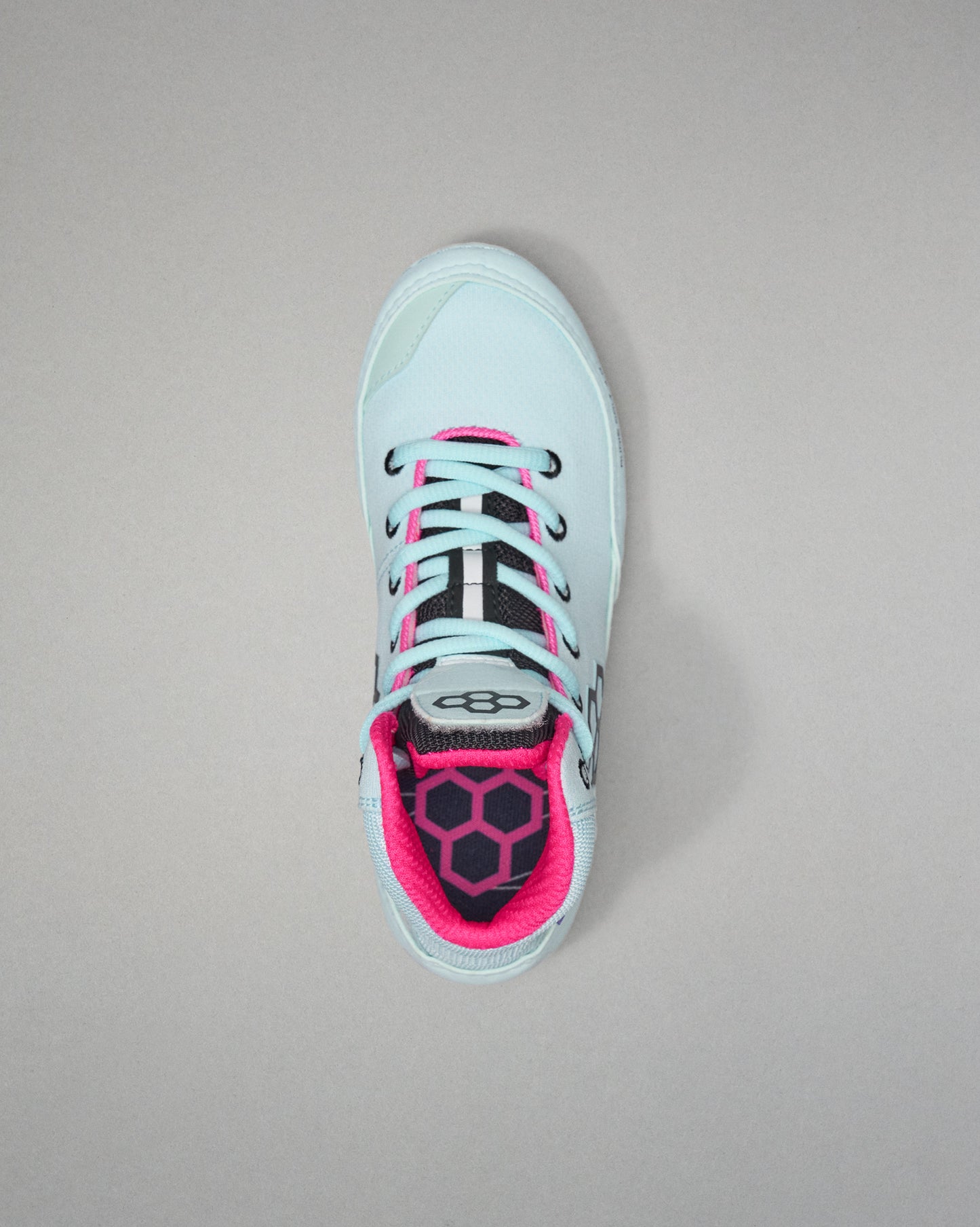 Light blue sneaker with pink accents on a gray background