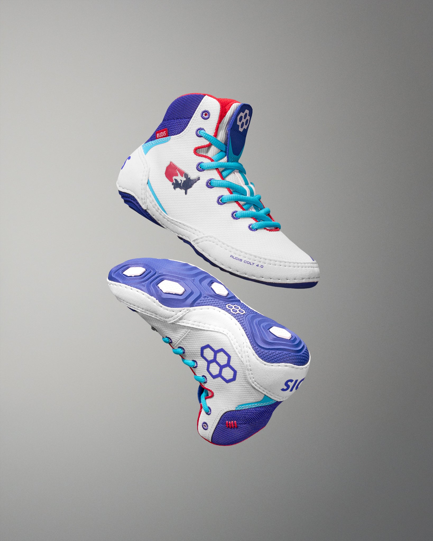 White USA Wrestling Shoes with blue and red accents on a gray background