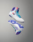 White USA Wrestling Shoes with blue and red accents on a gray background