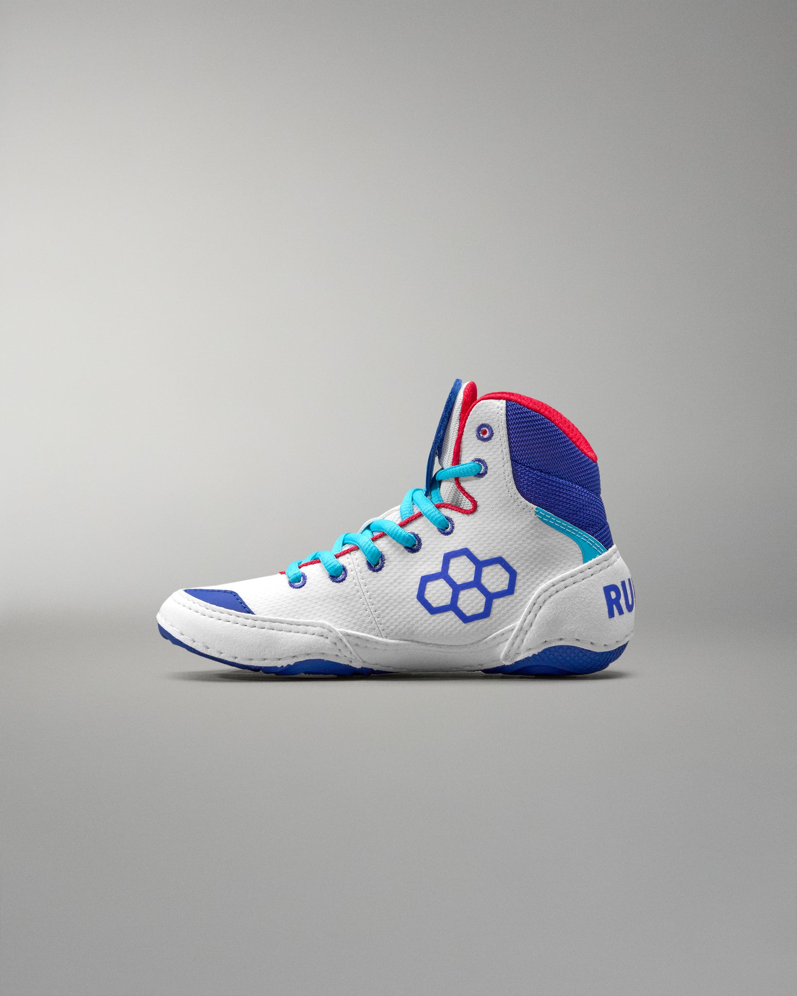 White USA Wrestling Shoes with blue and red accents on a gray background