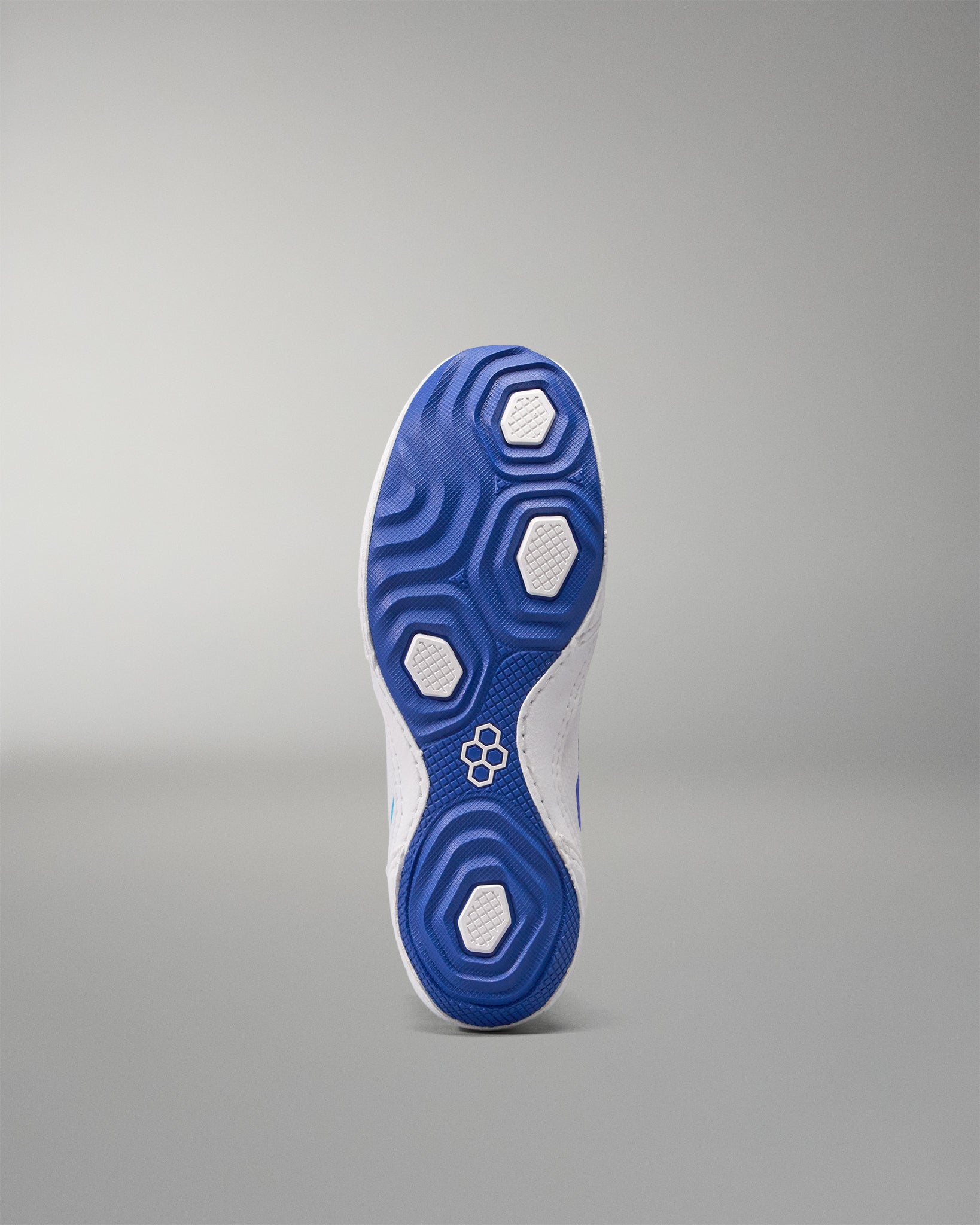 Blue and white athletic USA Wrestling Shoes sole on a gray background
