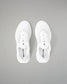 White sneakers with black text on a gray background