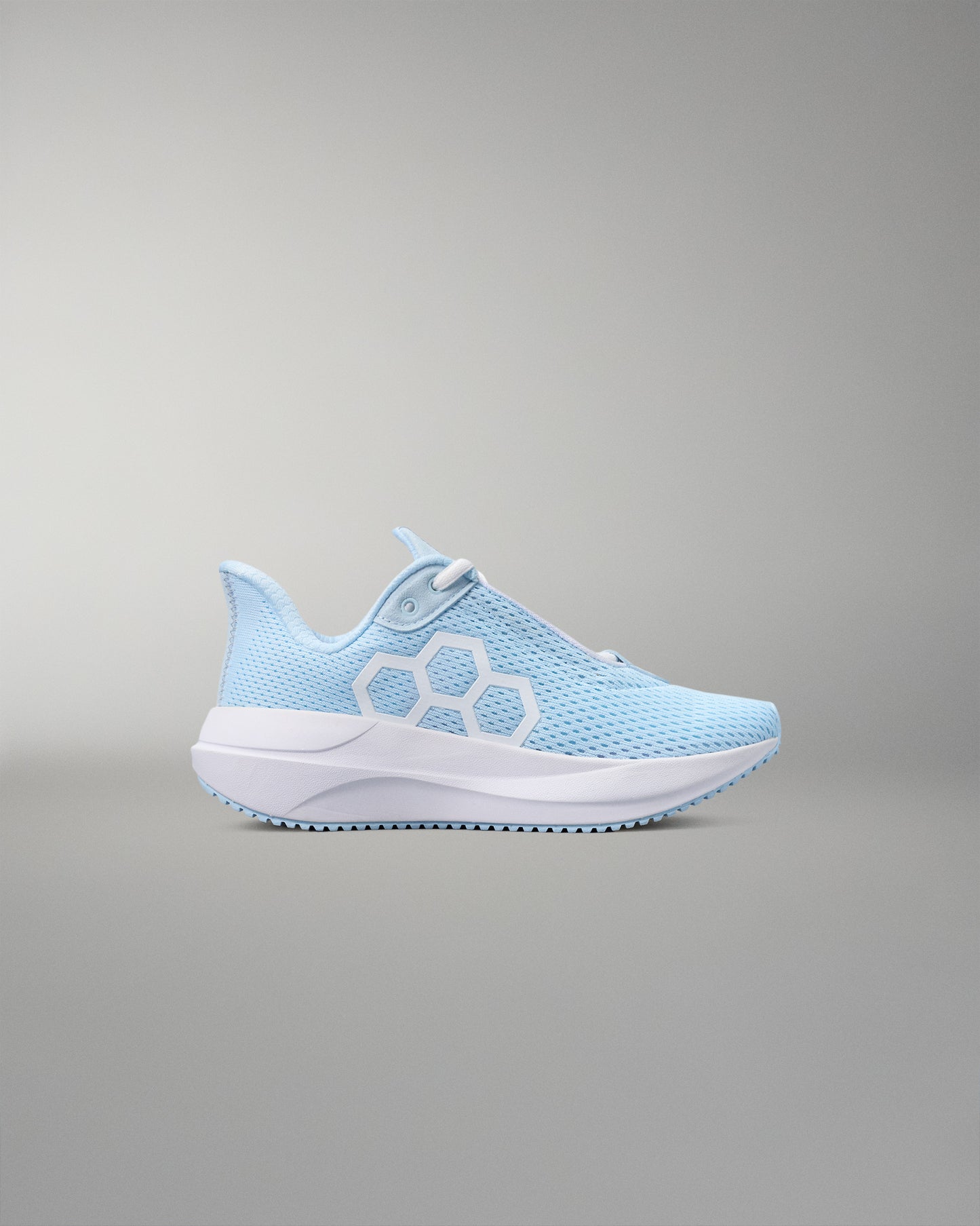 Light blue sneaker with white sole on a gray background