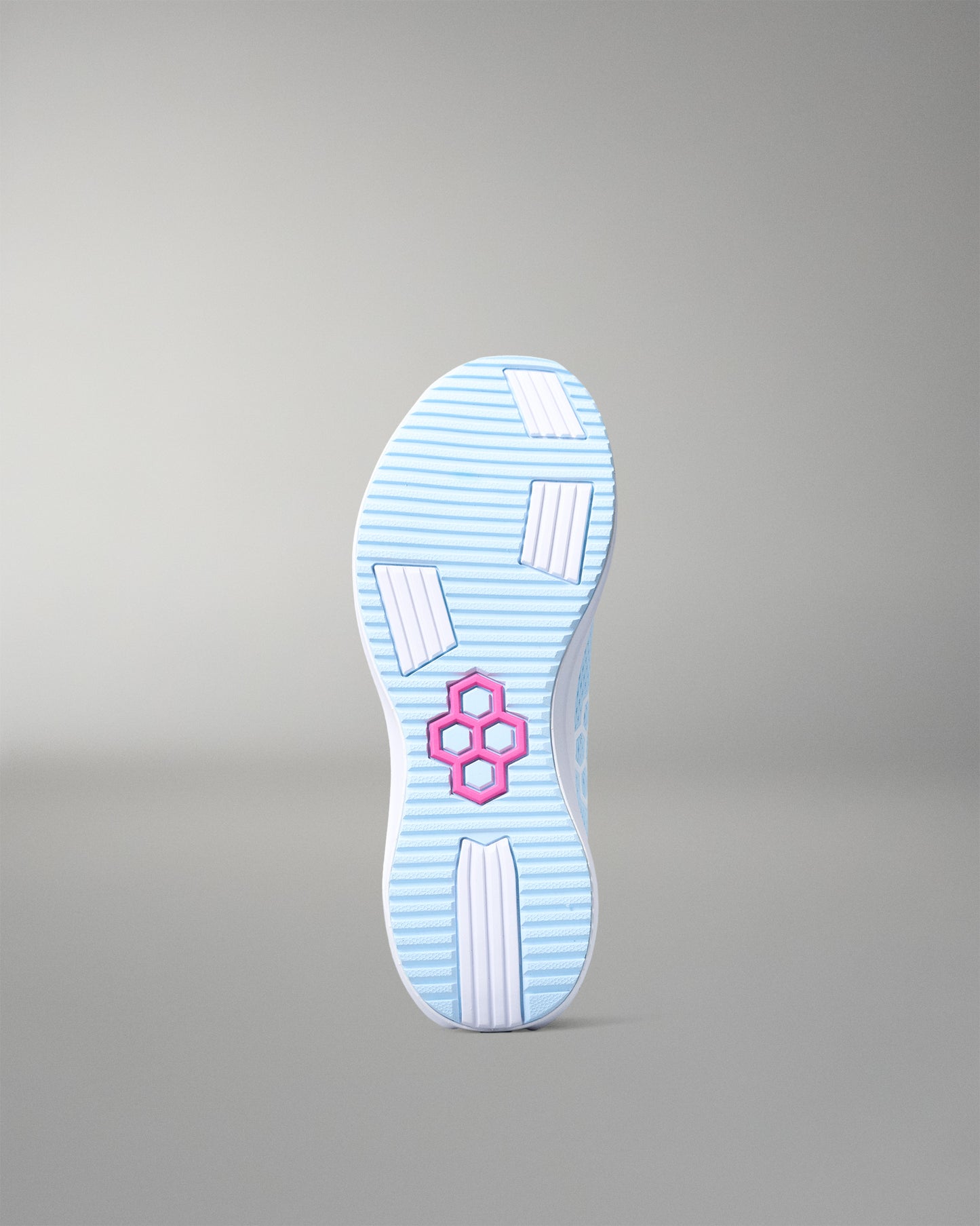 Light blue shoe sole with a pink logo on a gray background