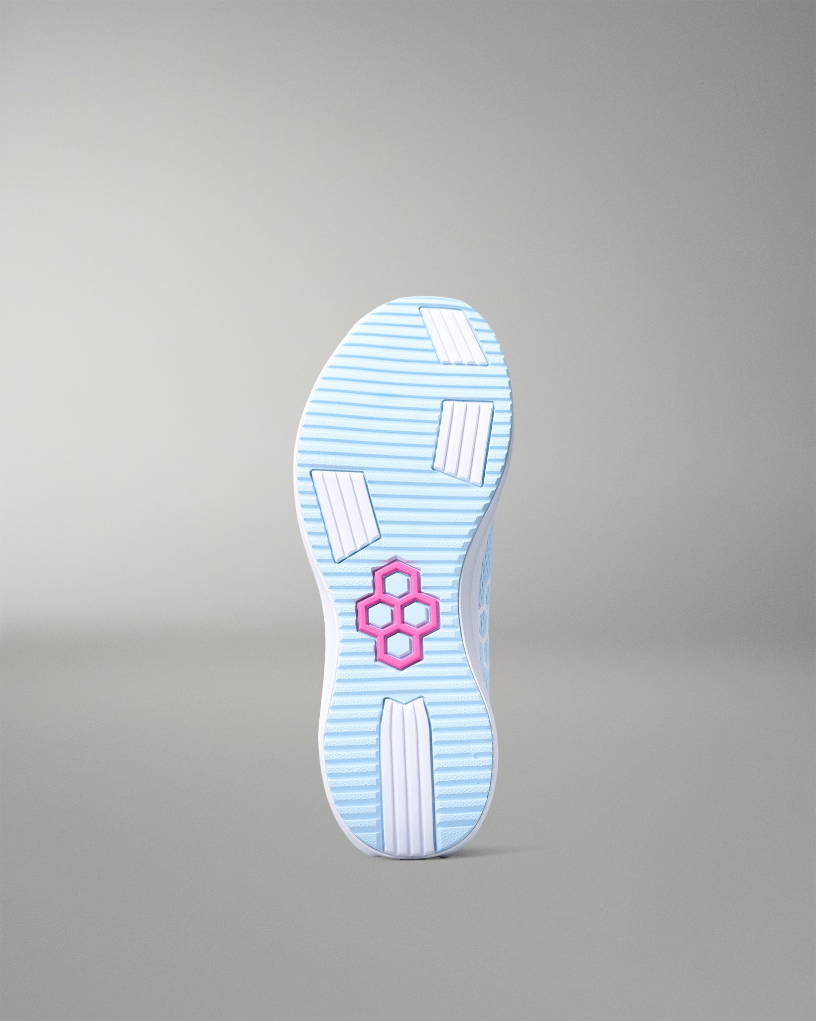 Light blue shoe sole with a pink logo on a gray background