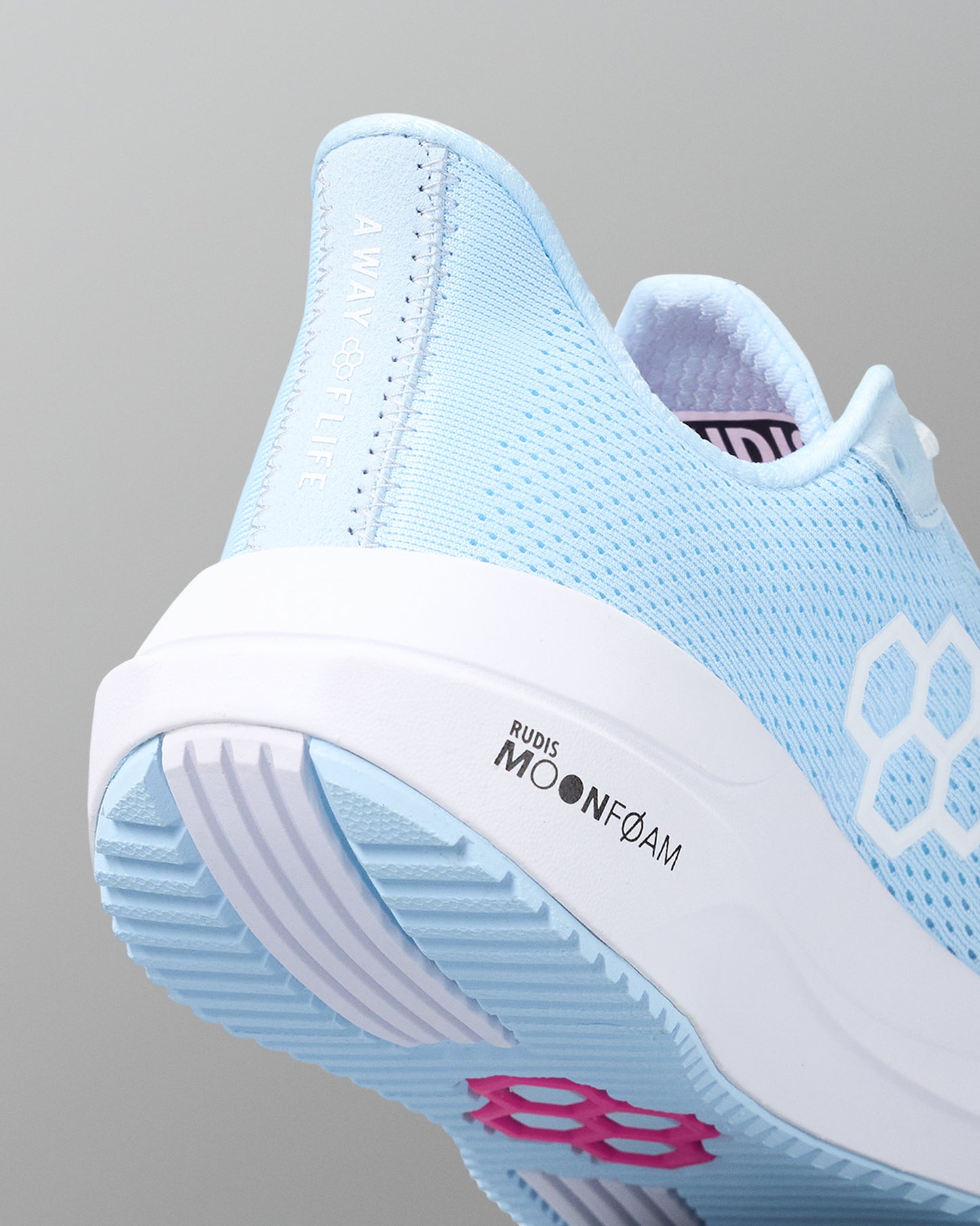 Light blue sneaker with white sole on a gray background
