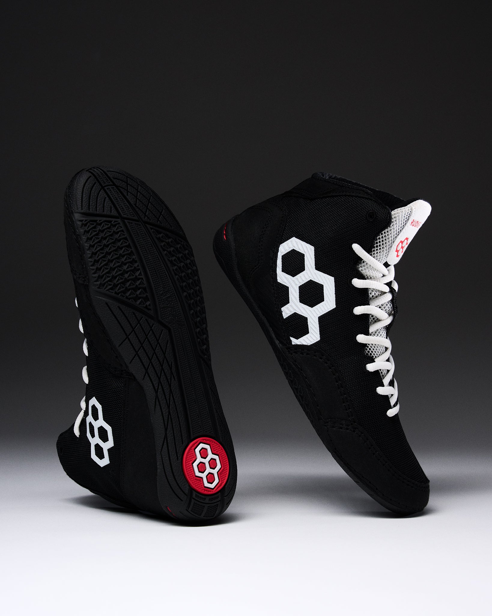 RUDIS Courage 2.0 Youth Wrestling Shoes in black with white laces displayed to showcase the side profile and high-traction outsole.