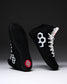 RUDIS Courage 2.0 Youth Wrestling Shoes in black with white laces displayed to showcase the side profile and high-traction outsole.