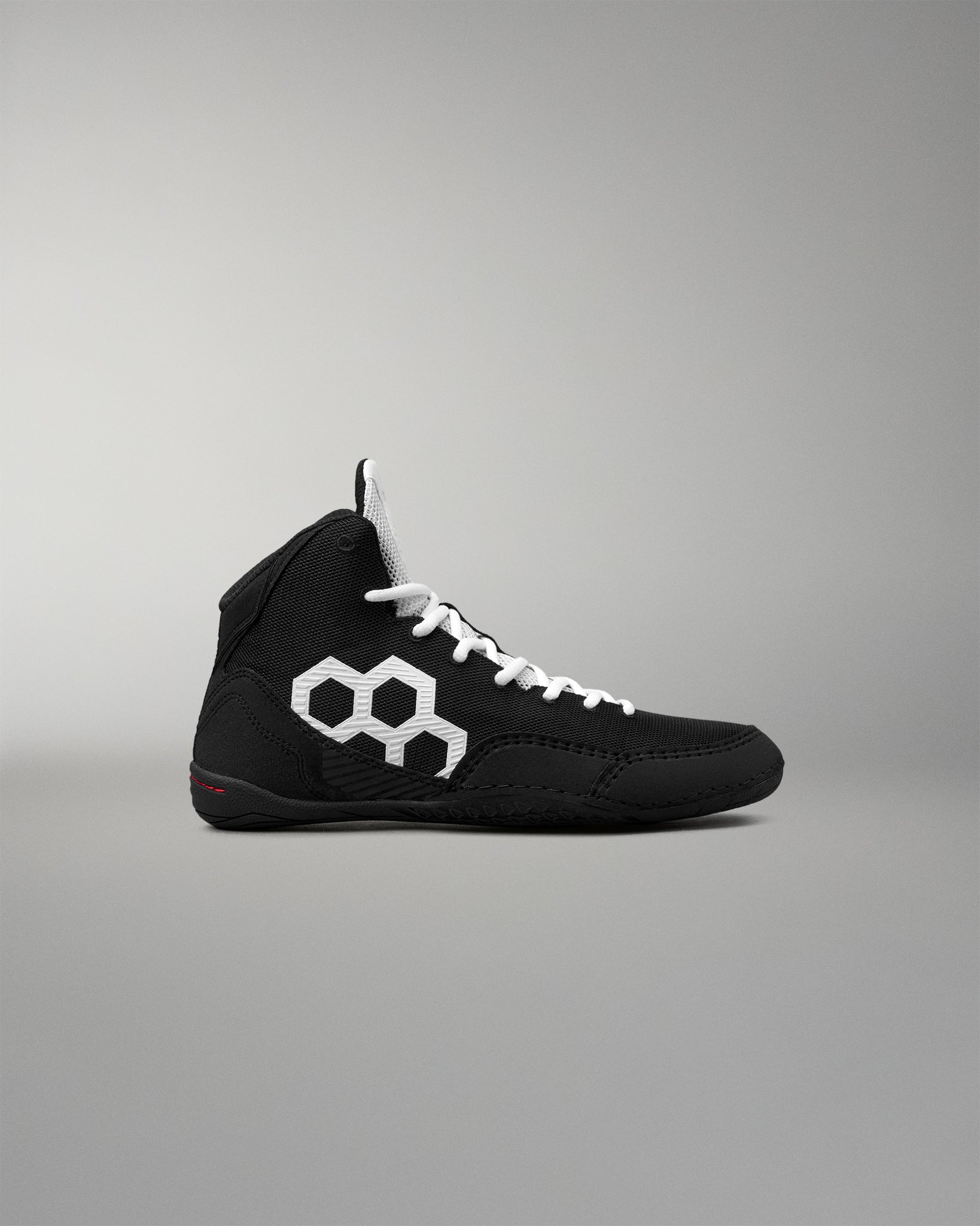 Side profile of the RUDIS Courage 2.0 Youth Wrestling Shoe with a lightweight black upper, white RUDIS logo, and supportive high-top construction.