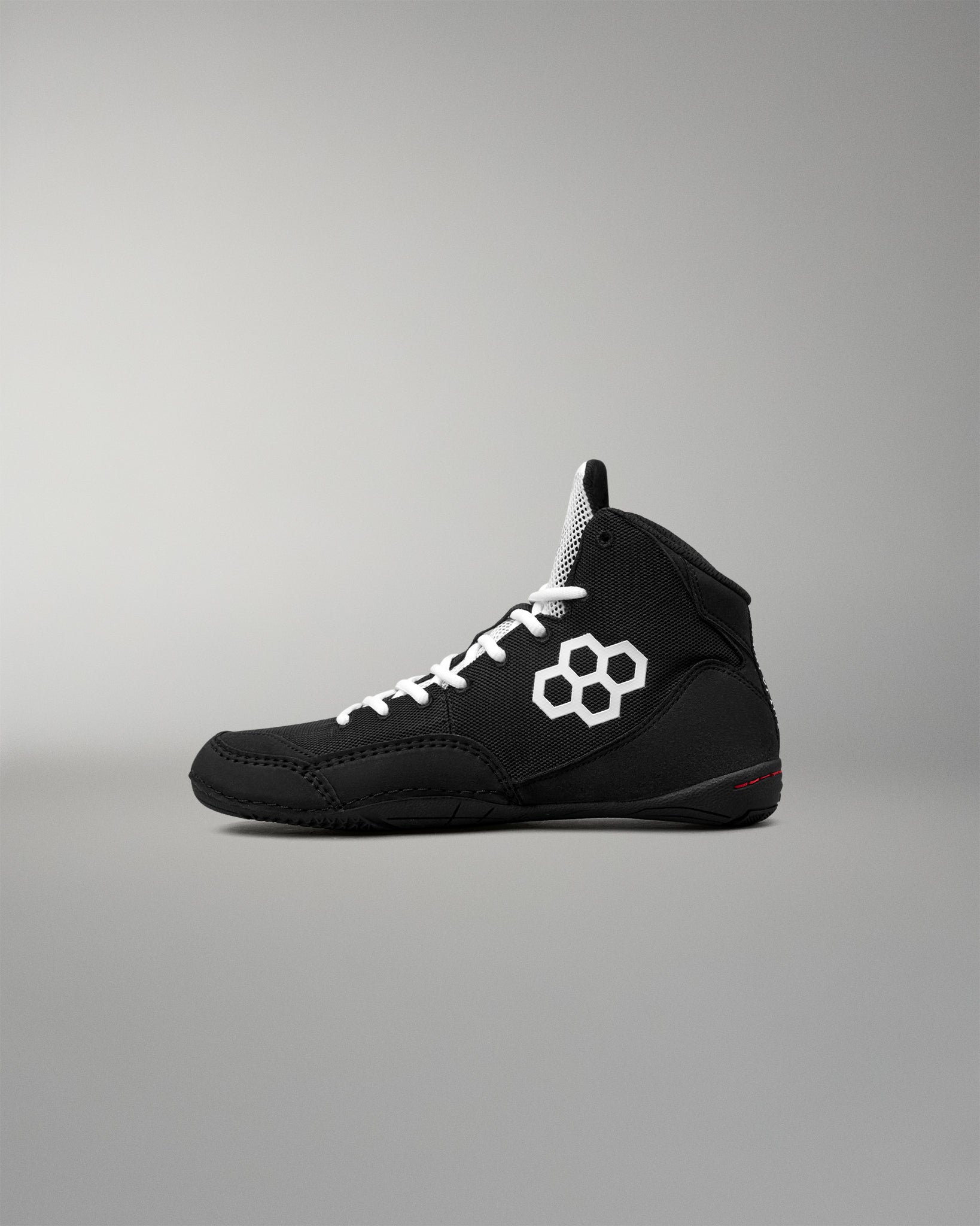 Opposite side view of the RUDIS Courage 2.0 Youth Wrestling Shoe highlighting the streamlined black design, white laces, and competition-ready profile.