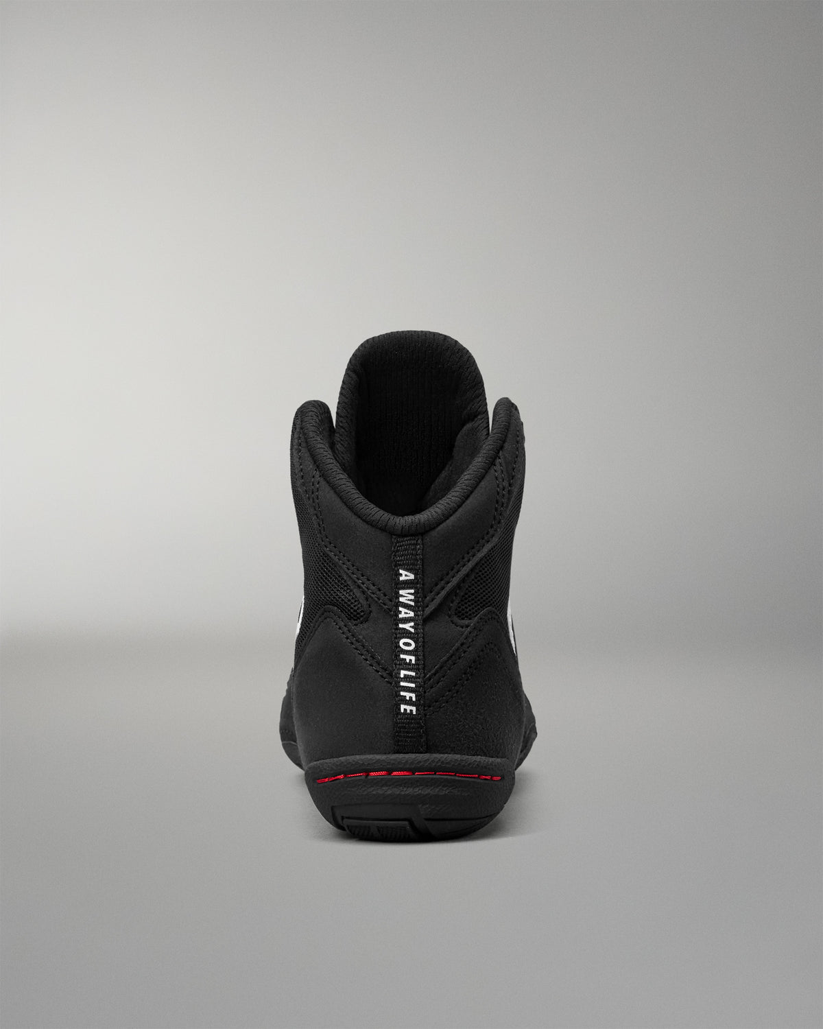 Rear view of the RUDIS Courage 2.0 Youth Wrestling Shoe showing the padded heel, "A Way of Life" pull tab, and supportive ankle collar.