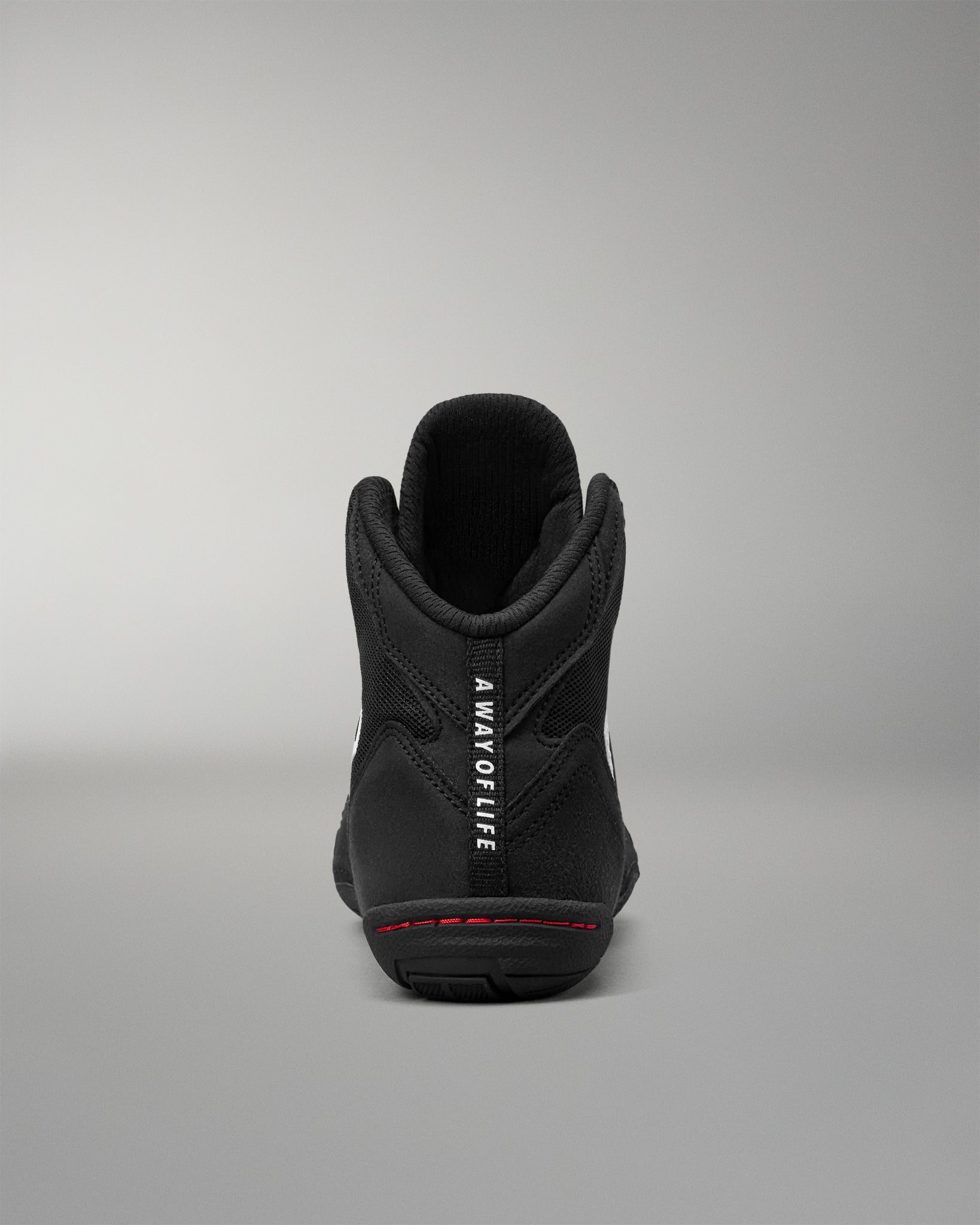 Rear view of the RUDIS Courage 2.0 Youth Wrestling Shoe showing the padded heel, "A Way of Life" pull tab, and supportive ankle collar.