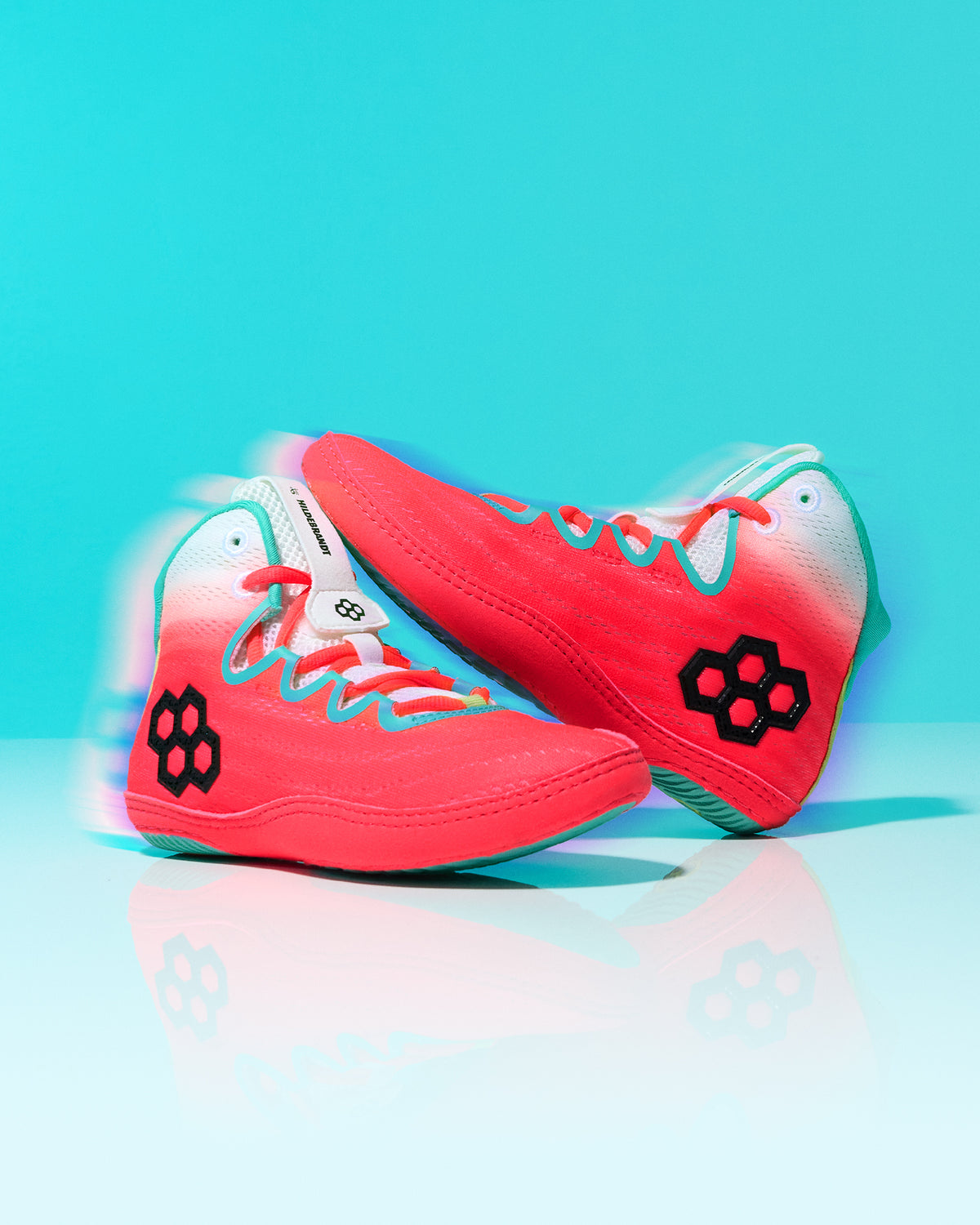 RUDIS Hildebrandt 2.0 Girls Wrestling Shoes in Neon Surge displayed together with coral uppers, teal accents, and black RUDIS logos.