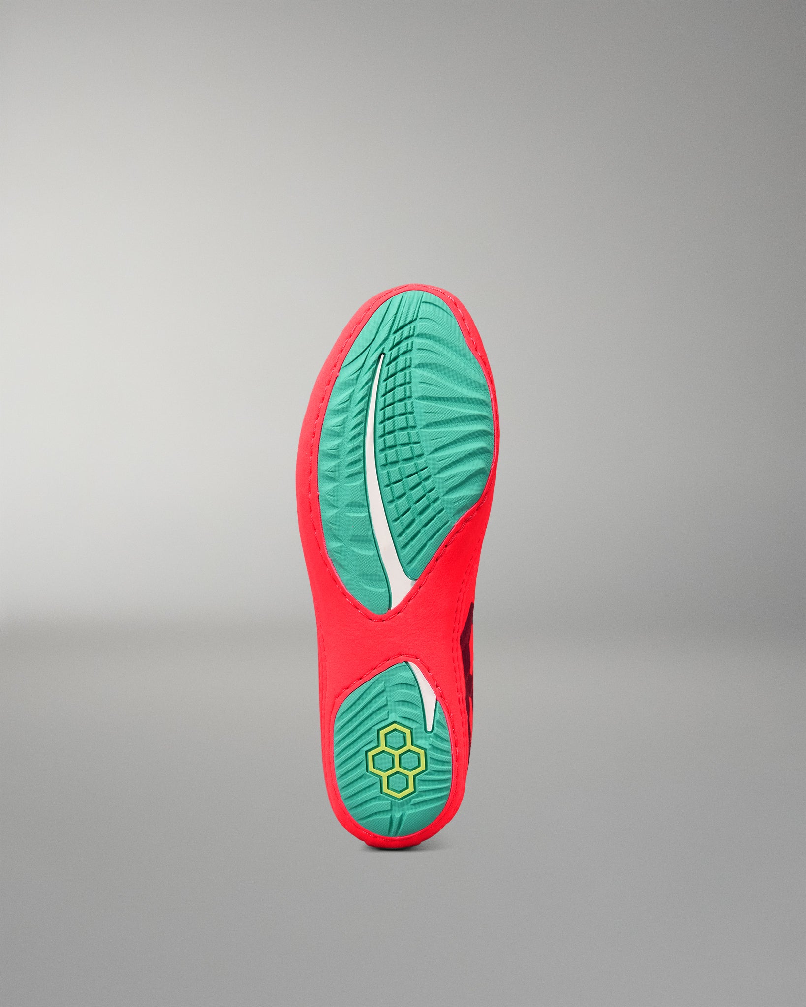 Bottom view of the RUDIS Hildebrandt 2.0 Girls Wrestling Shoe showing the teal split outsole and multidirectional traction pattern.