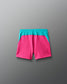 Pink shorts with teal waistband on a gray background