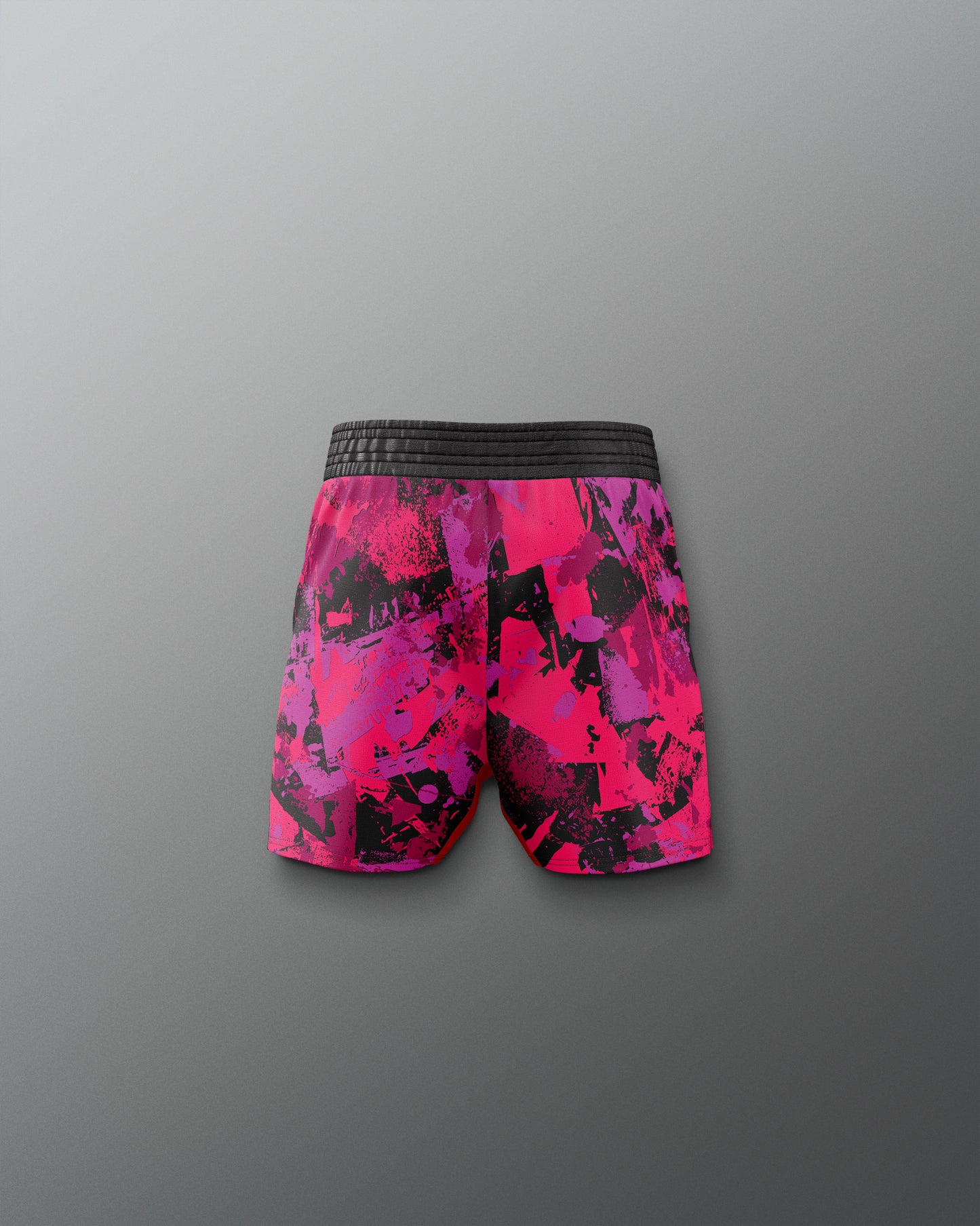 Pink and black patterned shorts on a gray background