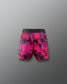 Pink and black patterned shorts on a gray background