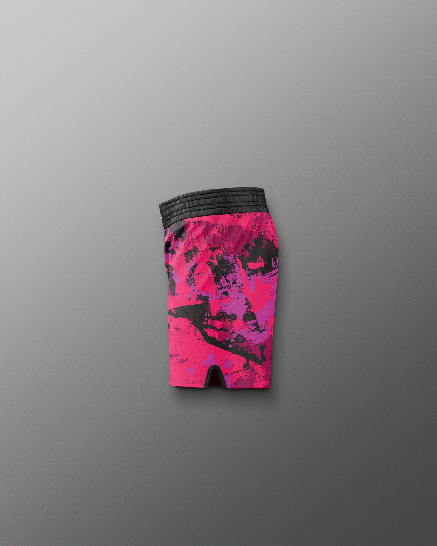 Pink and black patterned shorts on a gray background
