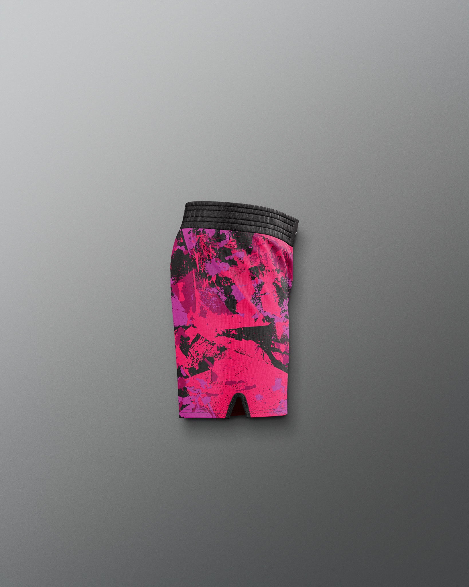 Pink and black patterned shorts on a gray background
