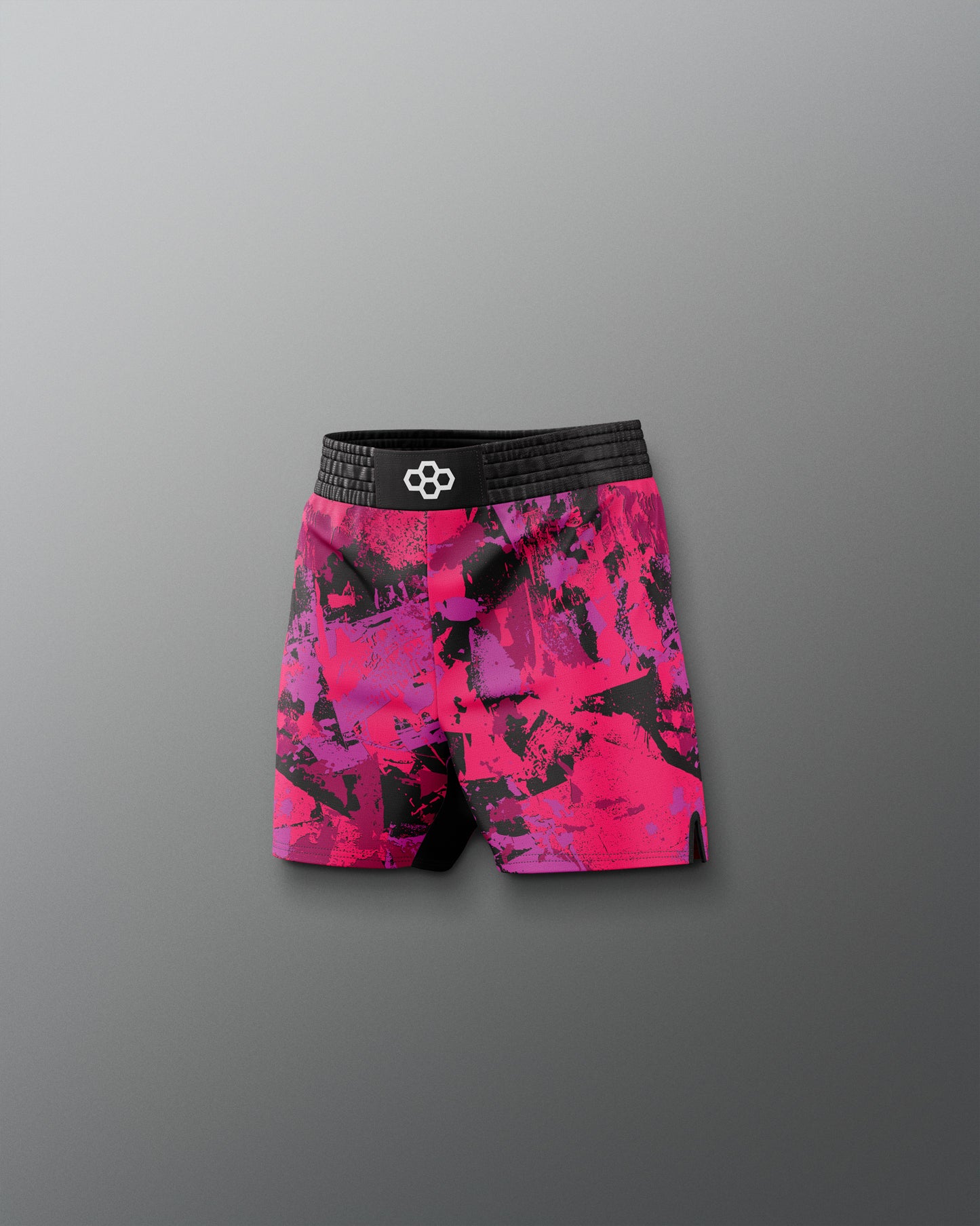 Pink and black patterned shorts on a gray background