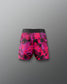 Pink and black patterned shorts on a gray background